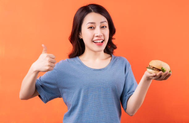 istock Woman eating 1311569967
