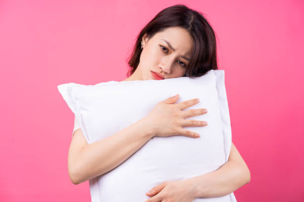 Sleep woman Asian woman is hugging pillow on pink background hot vietnamese women pictures stock pictures, royalty-free photos & images