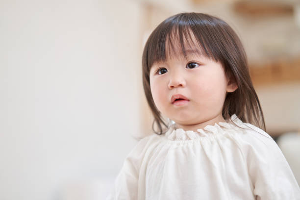 istock Asian toddler chasing mom with anxious look 1311576638