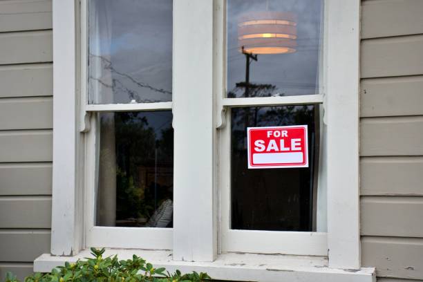 istock For Sale Sign Outside House 1311579209