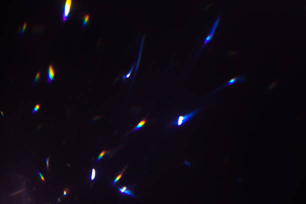 istock colorful warm rainbow crystal light leaks on black background 1311581010
