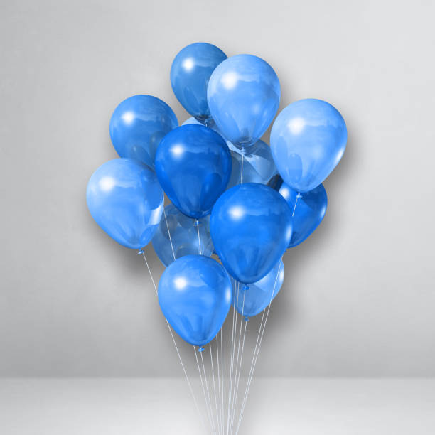 istock Blue balloons bunch on a white wall background 1311581153