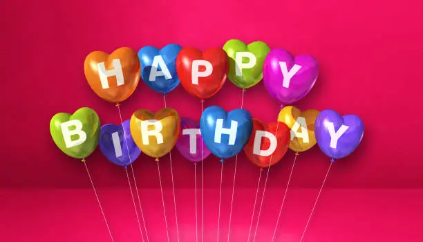 Colorful happy birthday heart shape air balloons on a pink background scene. Horizontal Banner. 3D illustration render