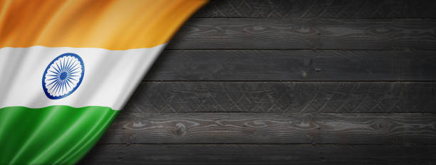 istock Indian flag on black wood wall banner 1311581285