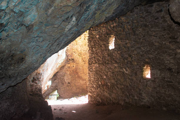 istock View inside a medieval residential tower with windows. A stone cave. 1311582828