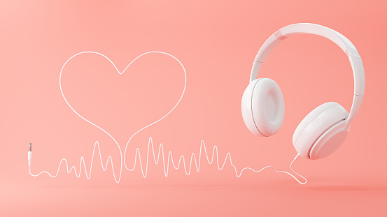 Listen to music and White headphone with sound wave cable heart on pink background. Valentine love song concept. 3d rendering