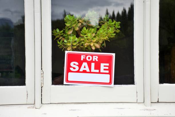 istock For Sale Sign in House Window 1311583078