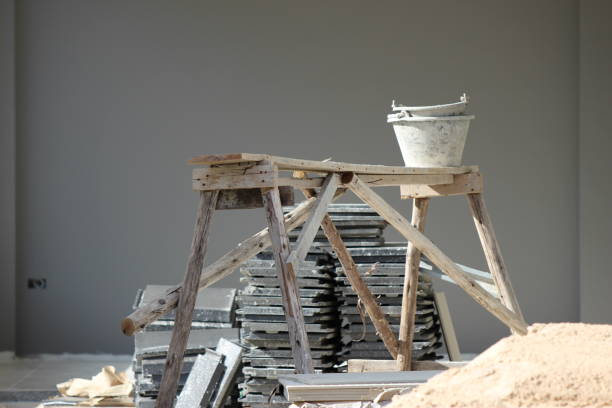 istock Contruction supplies and a wooden worktop on a building site 1311584064