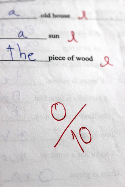 Score of zero on a genuine test paper Zero out of ten on a real exam paper with red crosses next to student answers. zero errors stock pictures, royalty-free photos & images