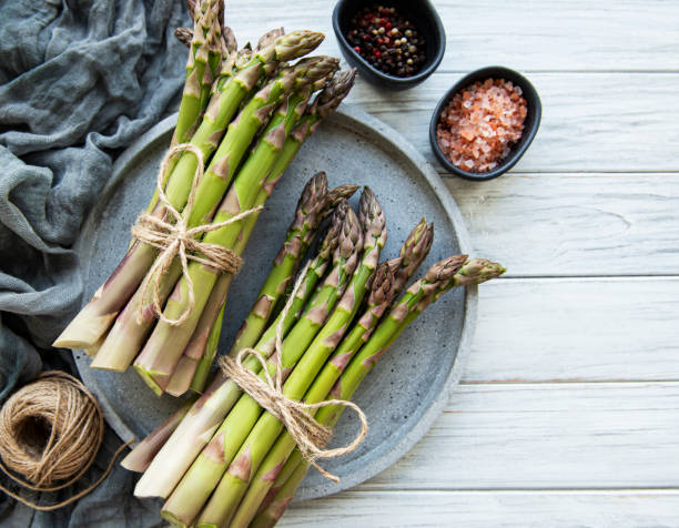 istock Bunch of raw asparagus stems 1311584977