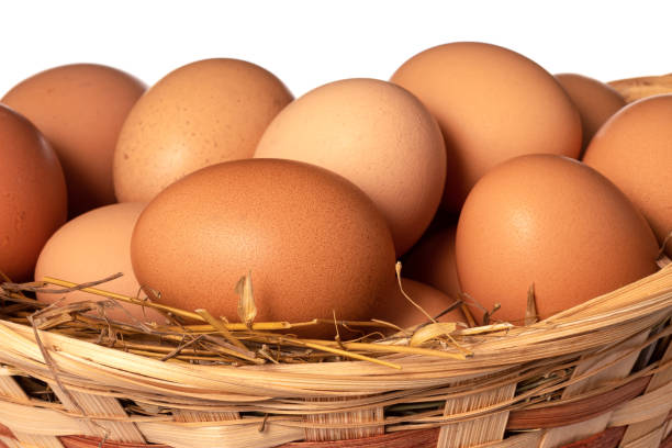 istock Chicken eggs in basket Isolated on white background. close up 1311588051