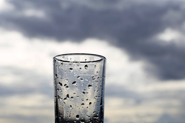 Glass with water drops, concept of rainy weather