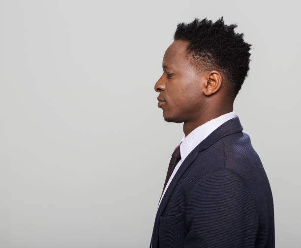 istock Side view of man wearing suit 1311590349