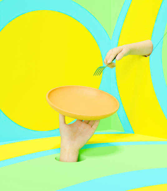 istock hand  holding a tray with another hand holding a fork 1311591838