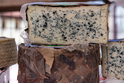 Roquefort cheese is a blue cheese originating in Northern France and produced in different parts of the world from coagulated sheep's milk
