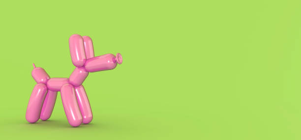 istock Pink balloon dog isolated on green. 1311592980