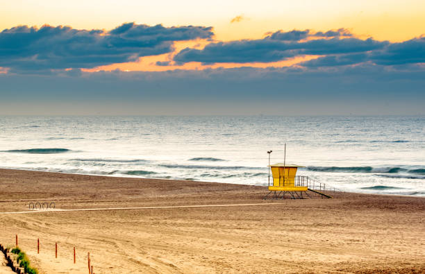 istock Deserted beach with hut, sunset 1311595153