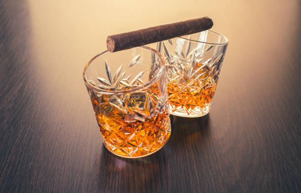 istock whiskey in glasses and cigar 1311595184