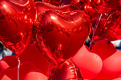 Heart shaped red balloons inflated