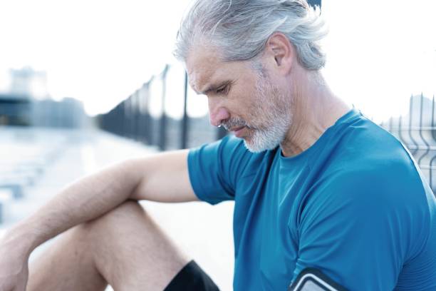 istock Tired Exhausted Middle-aged Man Resting After Running Outdoors. Handsome Runner Taking Break After Fitness Workout 1311595838