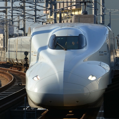 Shinkansen highspeed Bullet Train on the tracks on a sunny day in Kumamoto, Japan