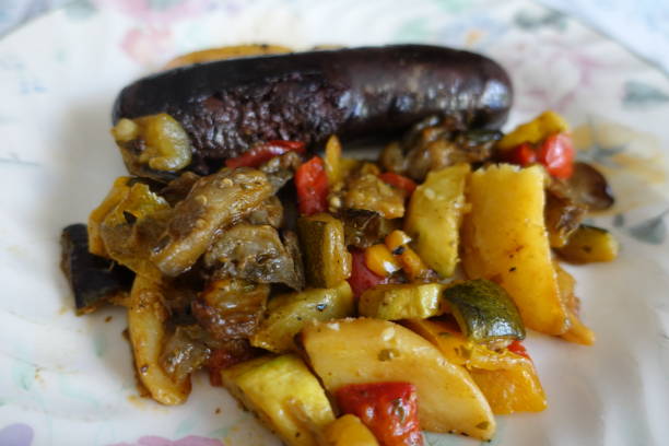 Black pudding served with ratatouille  French cooking