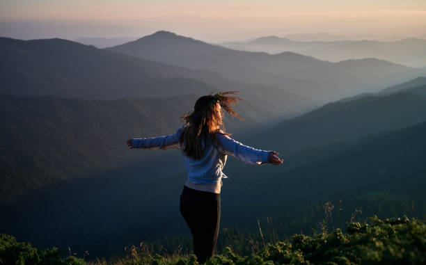 istock Young slim woman relaxing on fresh air. 1311601422