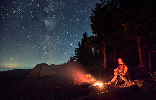 Relaxing On Nature Near Campfire And Tent Stock Photo - Download Image ...