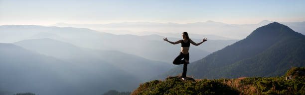 istock Beautiful woman doing meditation on fresh air. 1311601826