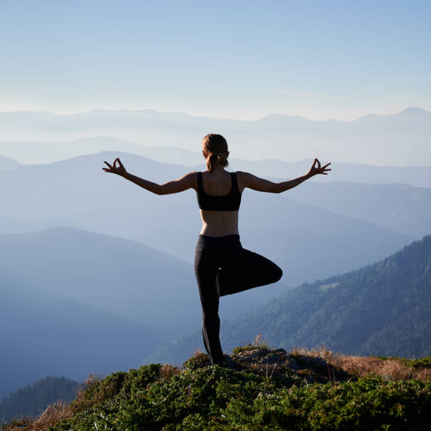 istock Slim woman doing meditation on nature. 1311601830