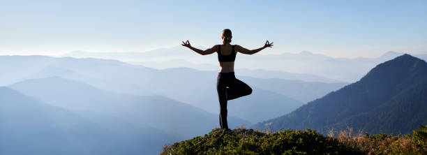 istock Sporty woman meditating on fresh air. 1311601855