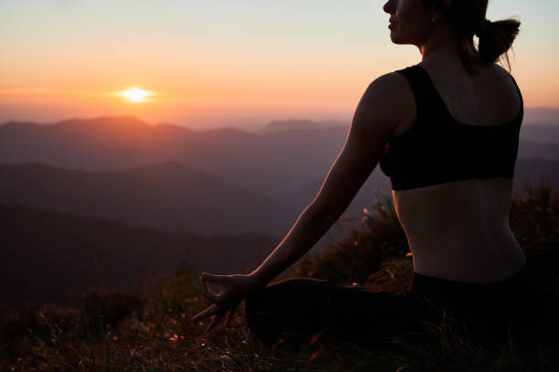 istock Beautiful woman doing meditation at dawn. 1311601924