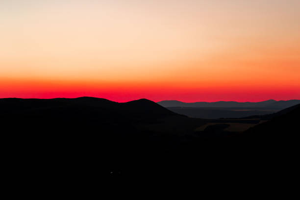 istock Red sunset with mountain silhouette. Scenery with mointains in sunset. 1311604133