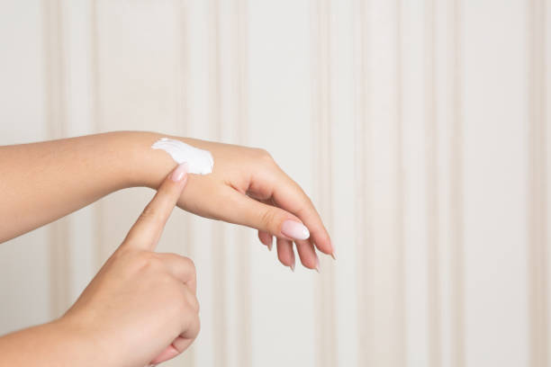 istock Woman applying moisturizing lotion. Closeup shot 1311605640