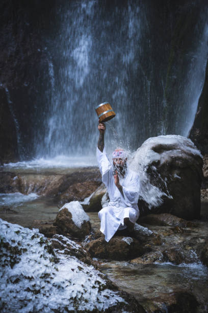 istock man in traditional japanese shugendo outfit doing waterfall meditation 1311608865