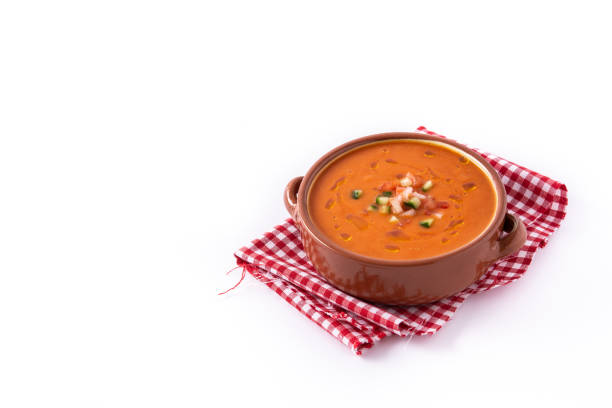 Gazpacho soup in crockpot isolated on white background