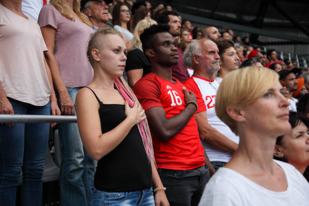 istock Listening to nationa anthem 1311611505