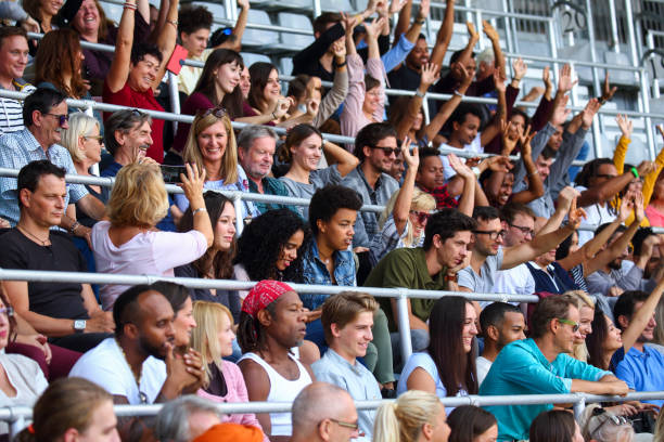 istock Ecstatic fans on the stadium cheering 1311611630