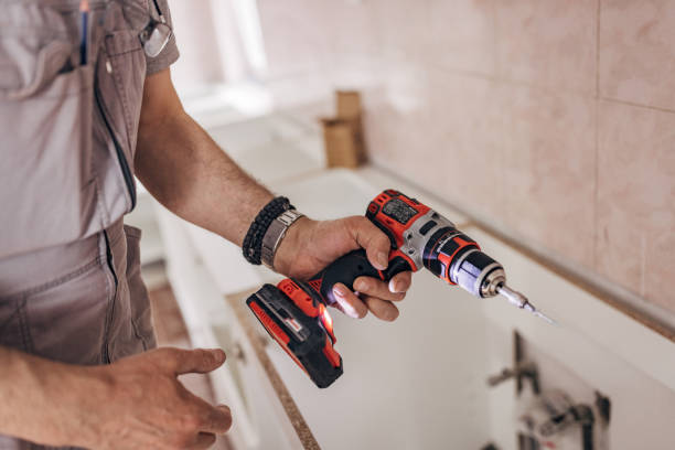 istock A carpenter holds a screwdriver in his hand 1311613013