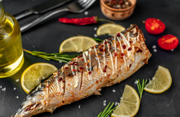 istock baked mackerel on a cutting board with lemon and spices on a stone background 1311613146
