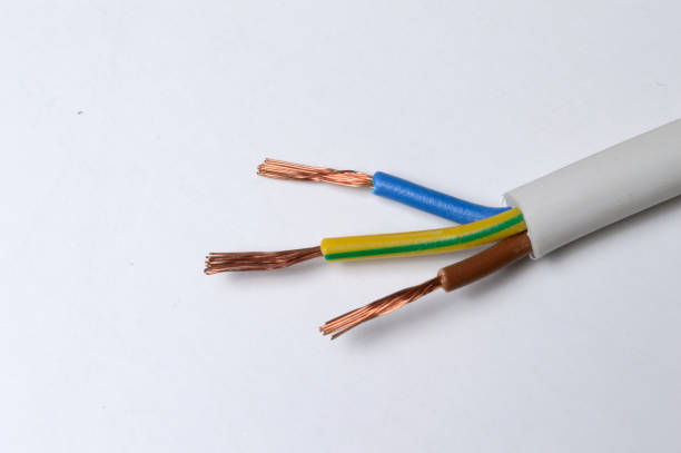 istock the stripped three-core wire lies on a light background. close-up 1311617278