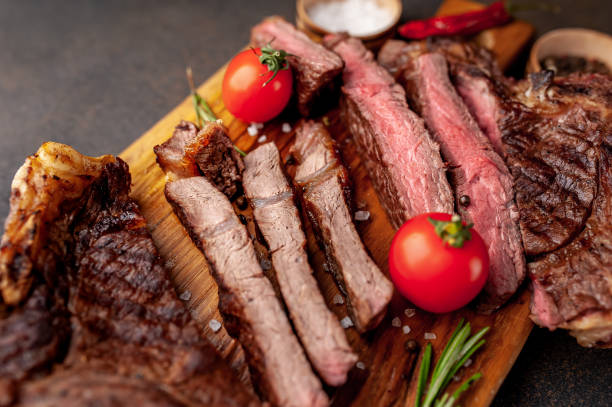 istock grilled beef steaks, different roasts on a stone background 1311617722