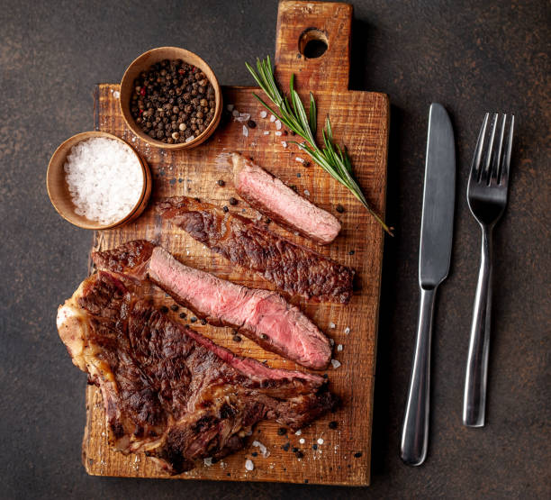 istock grilled beef steaks on stone background 1311618244