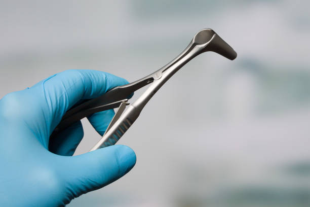 istock ENT Doctor's hand with a nasal speculum 1311619704