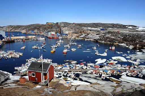 ships are filled in the harbor of Ilulissat, Greenland.
