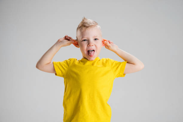 istock Happy boy isolated on white studio background. Looks happy, cheerful, sincere. Copyspace. Childhood, education, emotions concept 1311622557
