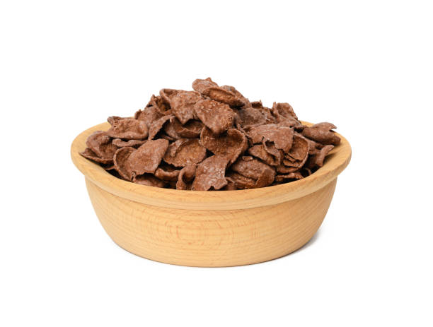 istock chocolate cornflakes in wooden plate isolated on white background 1311623607