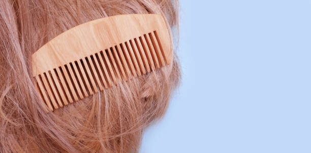 istock wooden comb beautiful hair background 1311623925