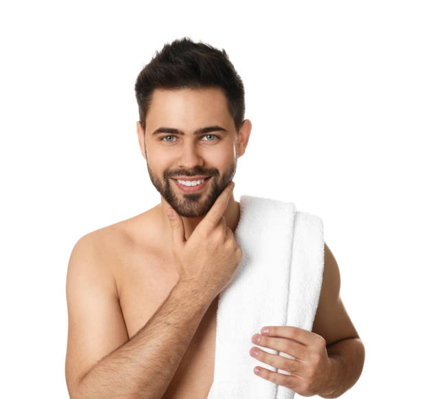 istock Handsome young man with beard after shaving on white background 1311624720
