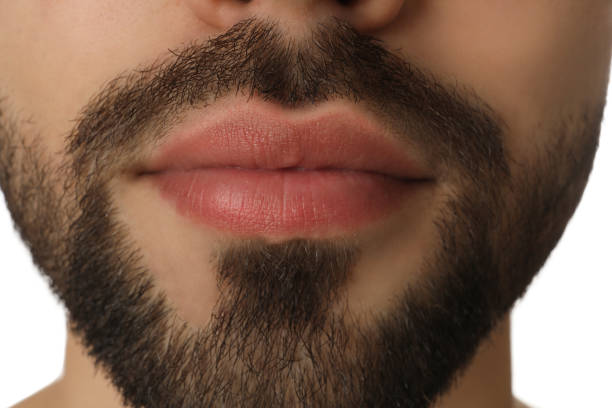 istock Young man with beard after shaving on white background, closeup 1311624787